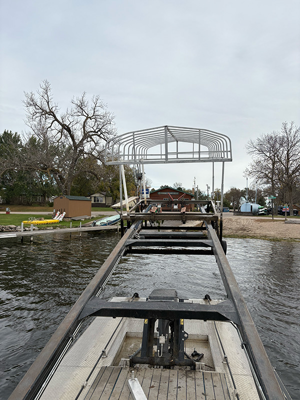 Boat lift with canopy frame positioned on lake in West Central Minnesota.