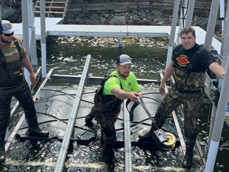 West Central Docks crew servicing boat lift in West Central Minnesota lake.