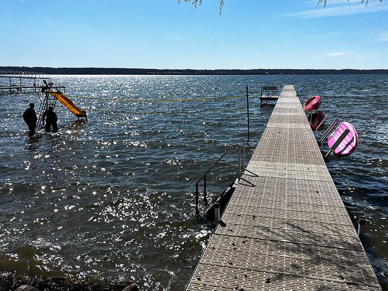 Aluminum lake dock with swim ladder and water slide in West Central Minnesota.