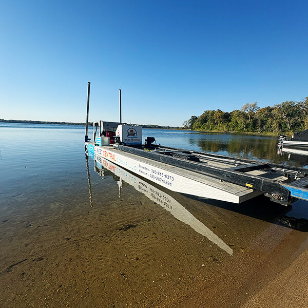 West Central Docks service barge on lake shoreline in West Central Minnesota.