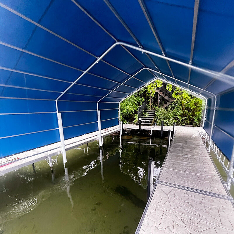 Interior view of blue boat lift canopy on dock in West Central Minnesota.