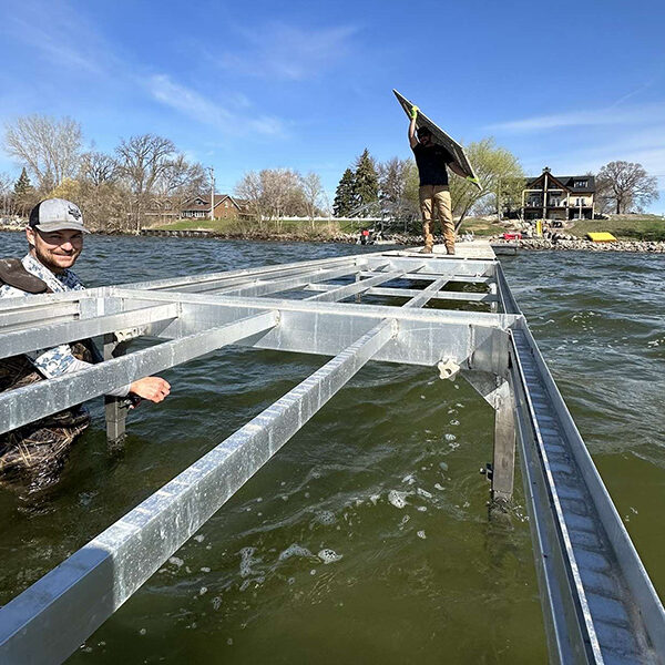 West Central Docks crew installing aluminum dock frame in West Central Minnesota lake.