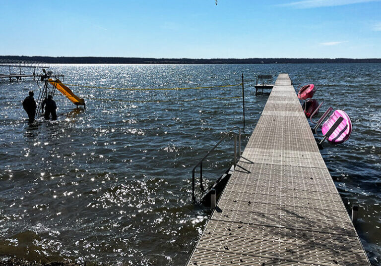 Aluminum lake dock with swim ladder and water slide in West Central Minnesota.